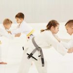children-training-during-karate-lesson-D8VHM3K